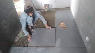 Master ceramic 24x24 mate tile washroom tile installation work [upl. by Dinny]