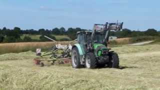 Andainage 2014 avec deutzfahr et un andaineur claas doubles toupies [upl. by Cud]