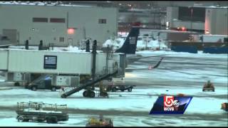 Plane hits deicing truck at Logan [upl. by Ahgem]