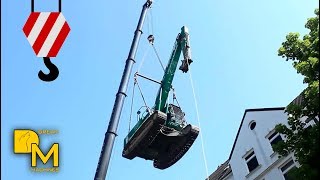 How to lift heavy demolition excavator on WW2 bunker with crane [upl. by Esinej95]