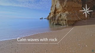 Tranquil waves by a large rock [upl. by Rabiah]