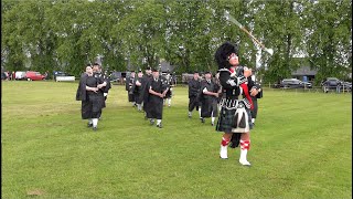 Mace flourish from Drum Major leading Kintore Pipe Band march during 2024 Oldmeldrum Highland Games [upl. by Jermain]