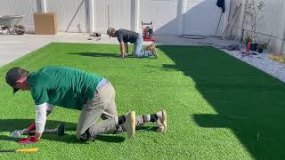 Laying and Nailing Artificial Grass  How to Install Artificial Turf [upl. by Cleodel]