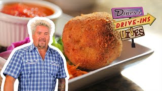 Guy Fieri Eats Luigis Arancini  Diners DriveIns and Dives  Food Network [upl. by Anitsirc795]