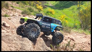 Meus Racing bodied Axial SCX24 124th rock crawler tackles the rocks [upl. by Luapnoj]