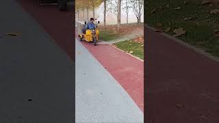 The process of clearing fallen leaves on sidewalks with high pressure water guns [upl. by Shanda]