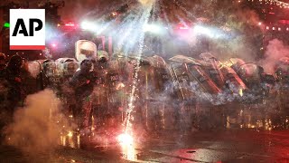 Protesters throw fireworks at police in Tbilisi after Georgias EU bid was suspended [upl. by Freytag]