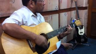 Zaw Myo Htut tuning an acoustic guitar [upl. by Fleur539]