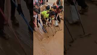 Residents of Paiporta clean streets after flooding [upl. by Samara]