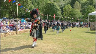 Drum Major leading massed bands playing Glendaruel Highlanders at 2023 Drumtochty Highland Games [upl. by Aihpled365]