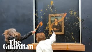 Moment protesters throw soup at Mona Lisa painting in Paris [upl. by Ijuy]