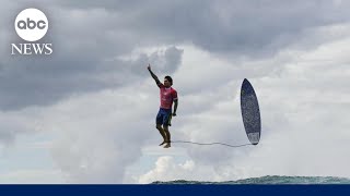 Viral photo of Olympic surfer’s midair celebration [upl. by Adanar704]