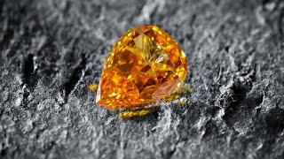 105 carat Fancy Vivid Yellow Orange Diamond [upl. by Giesser775]