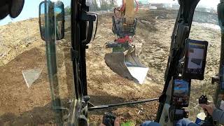 Topsoiling a pond with cat 320 nextgen rototilt R6 and Trimble earthworks part 3 [upl. by Eirehs]