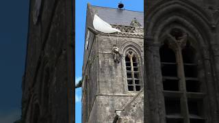 This mannequin hanging from a church is a tribute to an American soldier from the WW2 history [upl. by Glynnis]