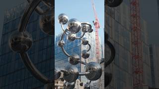 Yayoi Kusama installs mirrored orbs outside Liverpool Street Station in London  Shorts  Dezeen [upl. by Iem]