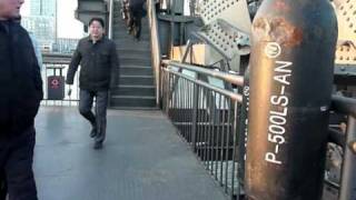 Chinese tourists peep across bridge into NKorea [upl. by Ennalorac319]