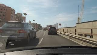 La panoramica strada sopraelevata di Genova lato mare con vedute del Porto Antico e dellAcquario [upl. by Lenes]