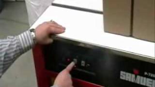 How to use a Strapping Machine  PTIPackagingcom [upl. by Amikan]