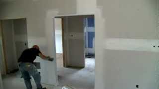 Coating a drywall bullnose corner bead with a hawk and trowel [upl. by Ynaoj]