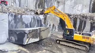 Excavator Hyundai 450 working in black Granite Quarry Pakistan [upl. by Dunn]