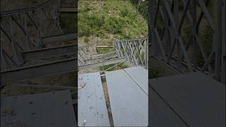 Man stand on a broken bridge above the river 😳 scarysupport shorts youtubeshort hangingaround [upl. by Aubyn]