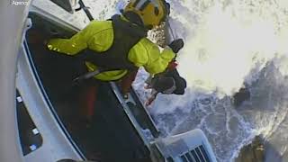 Incredible scenes of Coastguard winchman battered by 6ft waves during dramatic rescue [upl. by Chee]