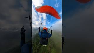 Emerging from the Clouds  Scenic Paragliding Flight Above Unterseen [upl. by Annaeoj]