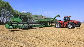 Harvest time in Germany with Case IH Steiger 450 HD  JampM 1326 grain cart and John Deere combines [upl. by Ligetti]