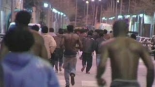 African migrants storm border into Spains Melilla [upl. by Hough]