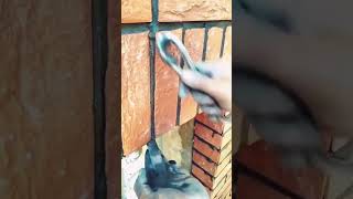 The process of scraping off excess plaster between exterior wall tiles [upl. by Aire]