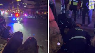 Motorcycle Cop Crashes Into Spectators at Holiday Parade [upl. by Opportuna87]