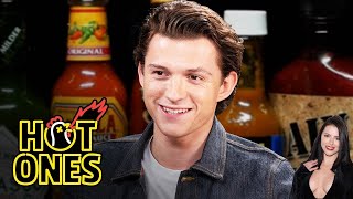 Tom Holland Calls for a Doctor While Eating Spicy Wings  Hot Ones  Adriana Reaction [upl. by Rudolph]