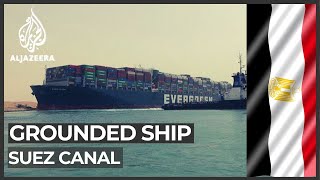 Suez Canal suspends traffic as tug boats work to free ship [upl. by Werdnaed]