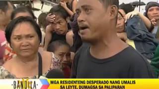 Desperate survivors wait for flight out of Tacloban [upl. by Ilehs]