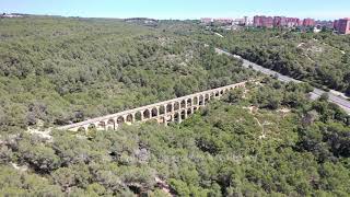 Aerial Stock Footage Flying with Drone over Nature with old Aqueduct bridge in Tarragona [upl. by Naleek]