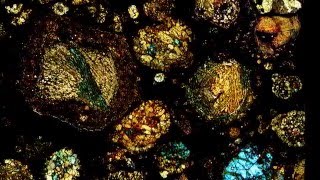 Microscopic views of thin sections of meteorite [upl. by Eidak218]