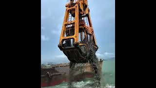 The grab bucket of a grab dredger is grabbing mud [upl. by Graehme]