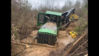 Stuck Skidder in the Swamp Creek Deere Logging Accident Disaster Trackhoe Excavator Rescue [upl. by Gusti349]