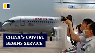 China’s C919 passenger jet completes maiden commercial flight from Shanghai to Beijing [upl. by Agate]