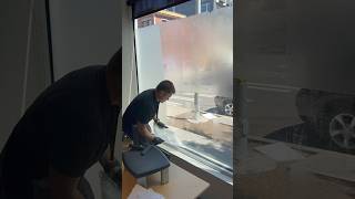 Process of removing old frosted window film in Seattle downtown windowfilm commercialwindowtint [upl. by Maxey]