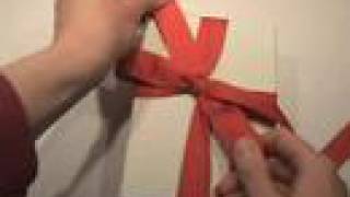 Tying a bow on a gift box [upl. by Kendy]