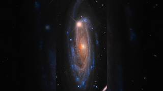 Spiral Galaxy with Luminous Core and Distant Stars in Deep Space views shorts [upl. by Annaj]