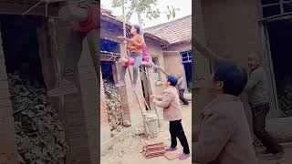 The process of moving bricks onto the roof with a rocker [upl. by Fernando]