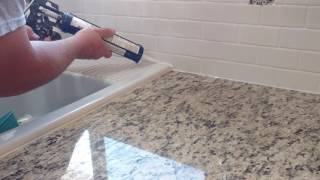 How to install silicone caulk around kitchen countertop shower bath tub etc [upl. by Ayifas131]