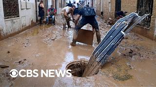 Devastating Spain flooding leaves mudslicked streets in Valencia region [upl. by Htbazile844]