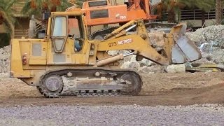 DOZER CATERPILLAR 973B LOADING TRUCKS WITH DEMOLITION DIRT BULLDOZER EXCAVATOR [upl. by Sansen]