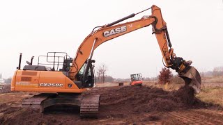 Case CX250C With An Engcon Tiltrotator Spreading Topsoil [upl. by Baudelaire36]