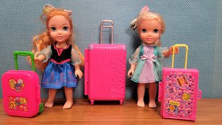 Luggage shopping  Elsa amp Anna toddlers are packing suitcase bags [upl. by Yenetruoc810]