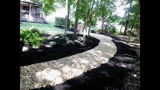 Installing river rock to solve some landscape problems [upl. by Eamaj172]